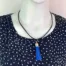 NL025-B-product-necklace-blue-tassel-black-cord-1
