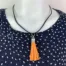 NL025-O-product-necklace-orange-tassel-black-cord-2